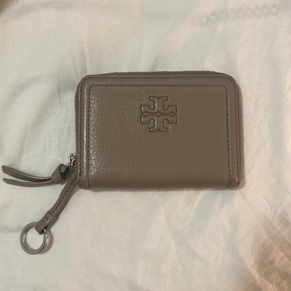 Like new tory burch wallet. Gray. 4 inches by 3 inches in size